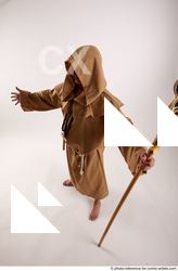 19 2019 01 JOEL ADAMSON MONK STANDING POSE WITH A…