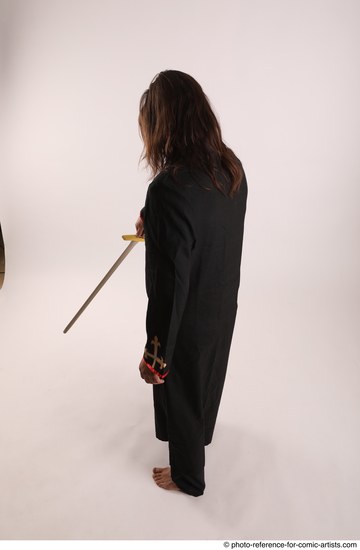 Man Adult Average White Fighting with sword Standing poses Coat