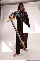Man Adult Average White Fighting with sword Standing poses Coat