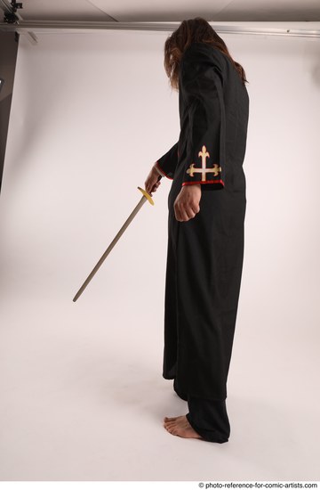 Man Adult Average White Fighting with sword Standing poses Coat