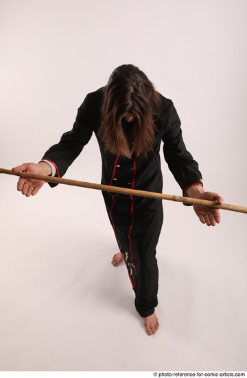 Man Adult Average White Fighting with spear Standing poses Coat