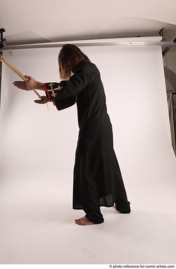 Man Adult Average White Fighting with spear Standing poses Coat