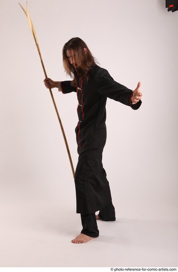 Man Adult Average White Fighting with spear Standing poses Coat