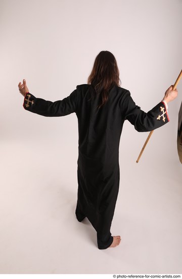 Man Adult Average White Fighting with spear Standing poses Coat