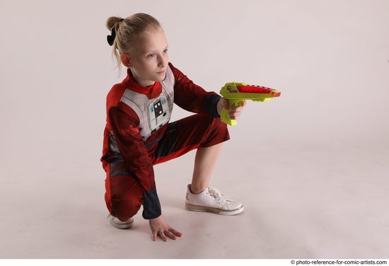 Woman Young Athletic White Fighting with gun Sitting poses Army