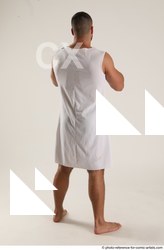 Man Adult Muscular Fist fight Standing poses Coat Latino