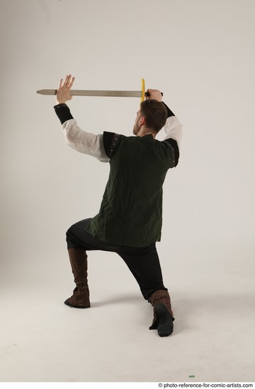Man Adult Athletic White Fighting with sword Kneeling poses Casual
