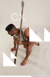 Man Adult Muscular Fighting with spear Kneeling poses Coat Latino