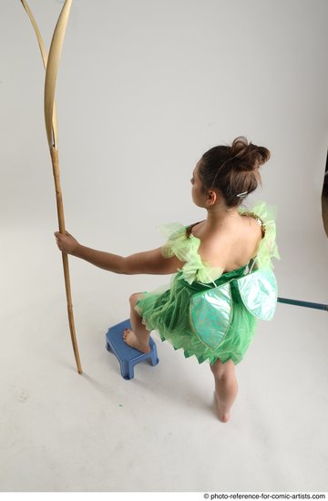 Woman Adult Average White Fighting with spear Standing poses Casual