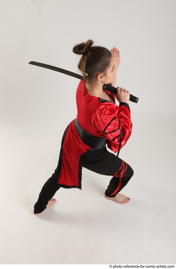 Woman Adult Average Fighting with sword Standing poses Coat Latino