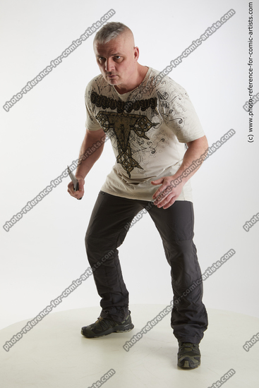 Man Adult Average White Fighting with knife Fight Casual