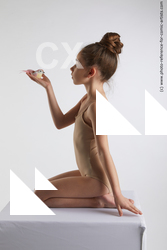 kneeling little girl with bird doroteya 02