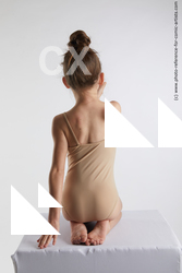 kneeling little girl with bird doroteya 04