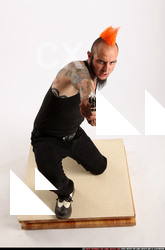 Edgar Kneeling Revolver Shooting 01