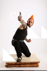 Edgar Kneeling Revolver Shooting 02