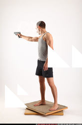 Frankie-standing-aiming-pistol