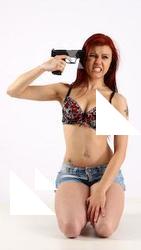 nina-sitting-pistol-pose3