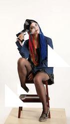 dolores-sitting-pistol-pose