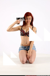 Nina Sitting Pistol Pose