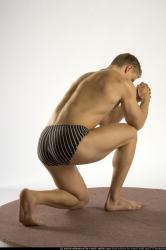 Man Young Muscular White Martial art Kneeling poses Underwear