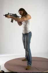 Man Young Muscular White Fighting with submachine gun Standing poses Casual