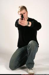 Man Young Chubby White Fighting with gun Kneeling poses Casual