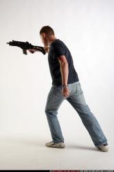 Man Adult Average White Fighting with submachine gun Standing poses Sportswear
