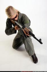 Woman Adult Athletic White Fighting with submachine gun Kneeling poses Army