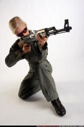 Woman Adult Athletic White Fighting with submachine gun Kneeling poses Army