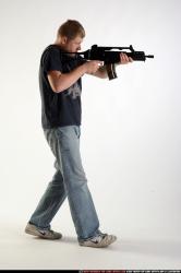 Man Adult Average White Fighting with submachine gun Moving poses Sportswear