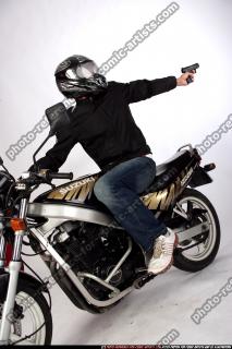 biker-shooting-back-pistol