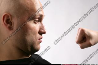 JAMESON FIST IN FRONT OF FACE 08