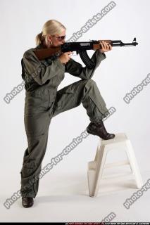ARMY SOLDIER STANDING ON CHAIR AIMING AK FEMALE 00.jpg