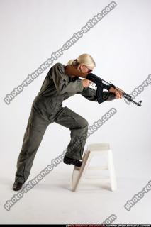 ARMY SOLDIER STANDING ON CHAIR AIMING AK FEMALE 02.jpg