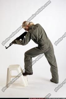 ARMY SOLDIER STANDING ON CHAIR AIMING AK FEMALE 04.jpg