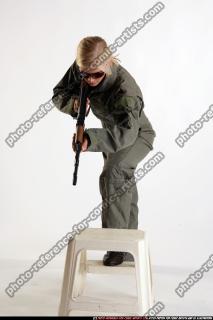 ARMY SOLDIER STANDING ON CHAIR AIMING AK FEMALE 05.jpg