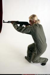 Woman Adult Athletic White Fighting with submachine gun Crouching Army