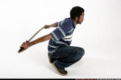 Man Young Athletic Black Fighting with sword Kneeling poses Sportswear