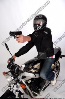 biker-shooting-front-pistol