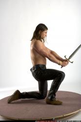 Man Adult Muscular White Fighting with sword Kneeling poses Pants