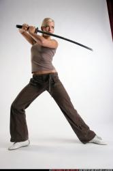 Woman Young Athletic White Fighting with sword Standing poses Sportswear
