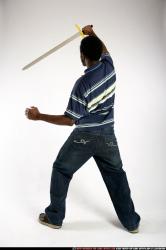 Man Young Athletic Black Fighting with sword Standing poses Sportswear