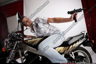 biker2-shooting-back-uzi