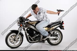 biker2-shooting-back-uzi