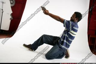 teenager-leaning-aiming-pistol