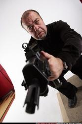 Man Old Chubby White Fighting with submachine gun Kneeling poses Casual
