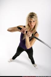 Woman Adult Athletic White Fighting with sword Standing poses Sportswear