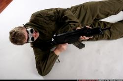 Man Adult Average White Fighting with submachine gun Laying poses Army