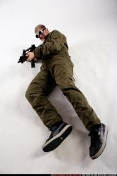 Man Adult Average White Fighting with submachine gun Laying poses Army