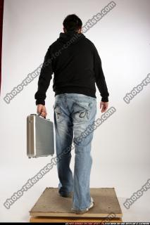 Jacob_White-walking-briefcase
